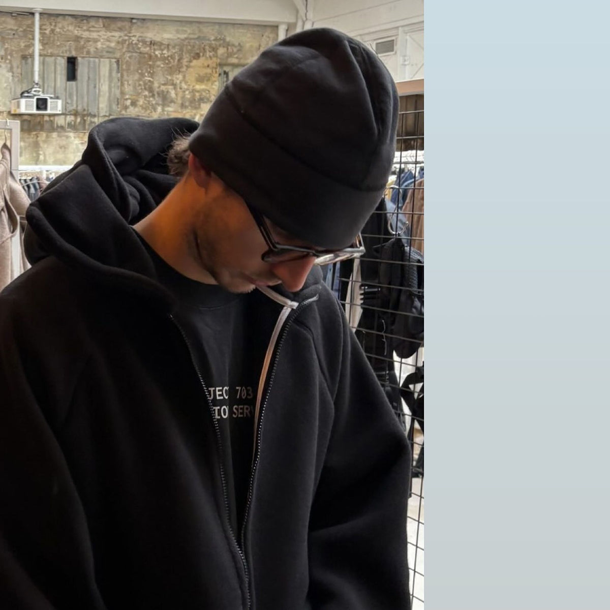 Man wearing the Thurston Power Wool™ Beanie in black, street-style portrait in an urban setting