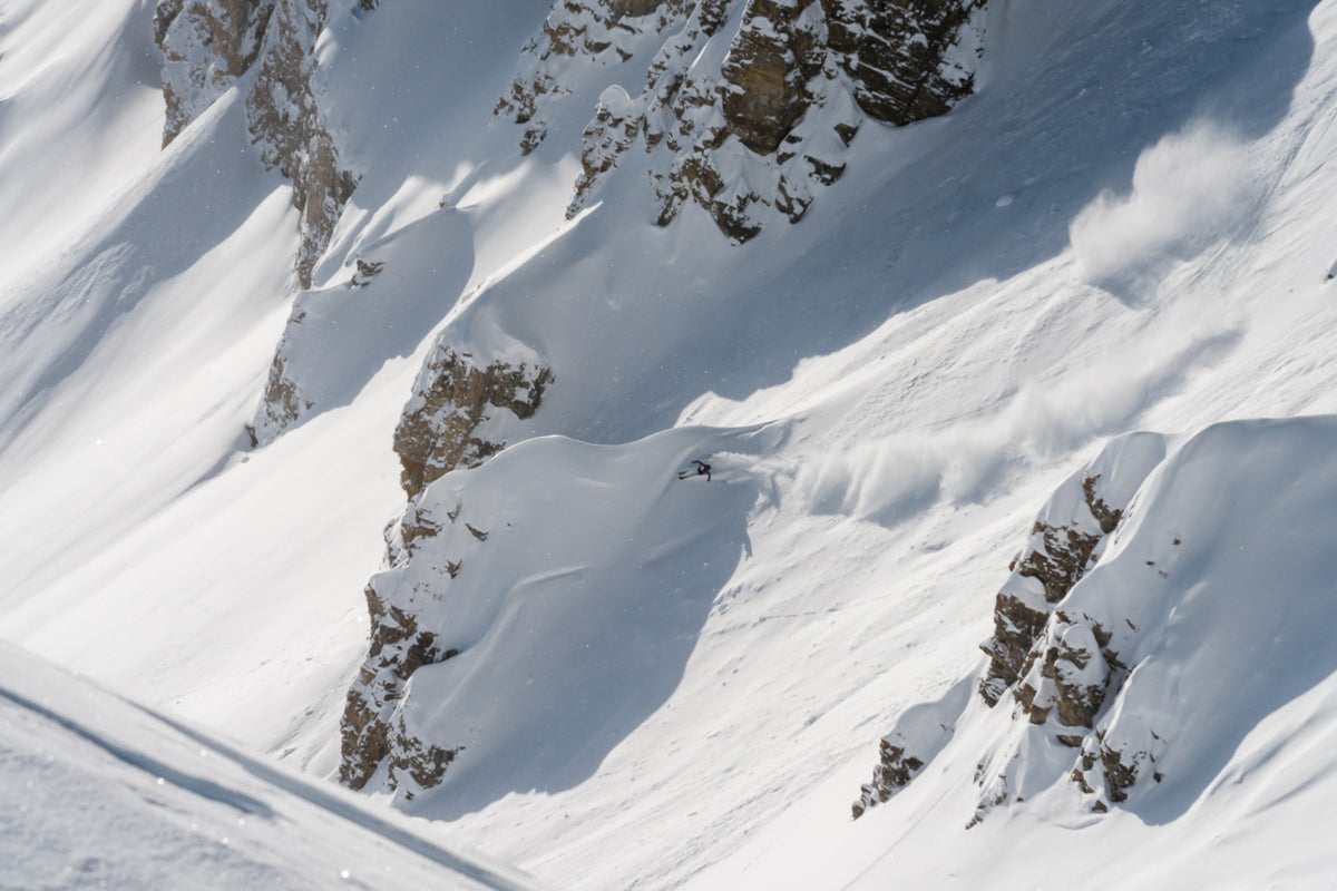 Victor Major skiing a steep, rocky powder line in Jackson Hole, photographed by Jake Burchmore