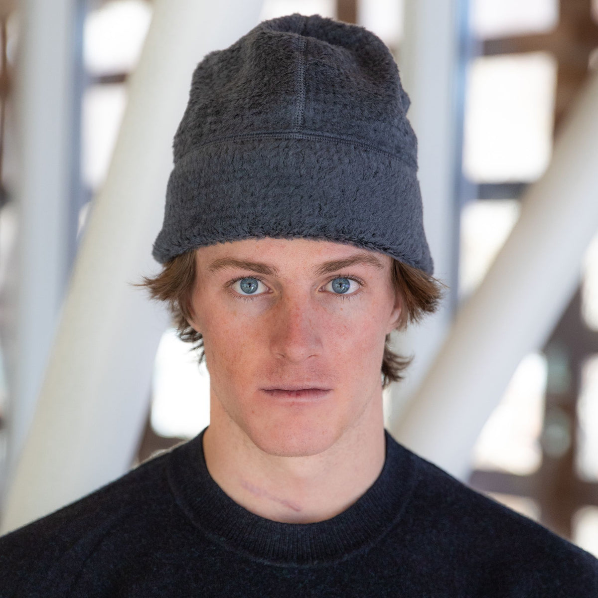 Man wearing the Thurston High Loft™ Wool Beanie in anthracite, studio portrait