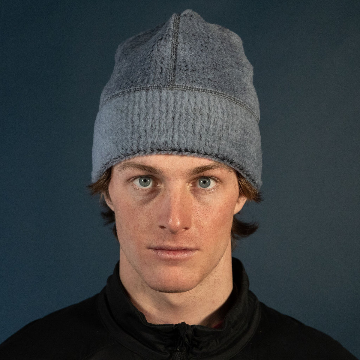 Man wearing the Thurston High Loft™ Wool Beanie in flintstone, studio portrait