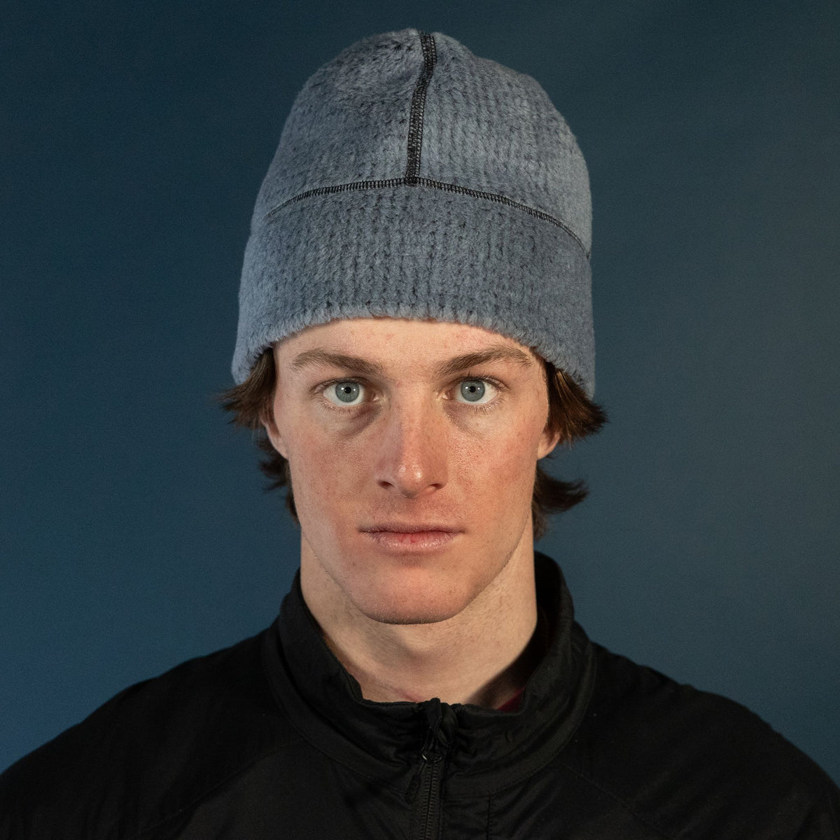 Man wearing the Thurston High Loft™ Wool Beanie in flintstone/black, studio portrait