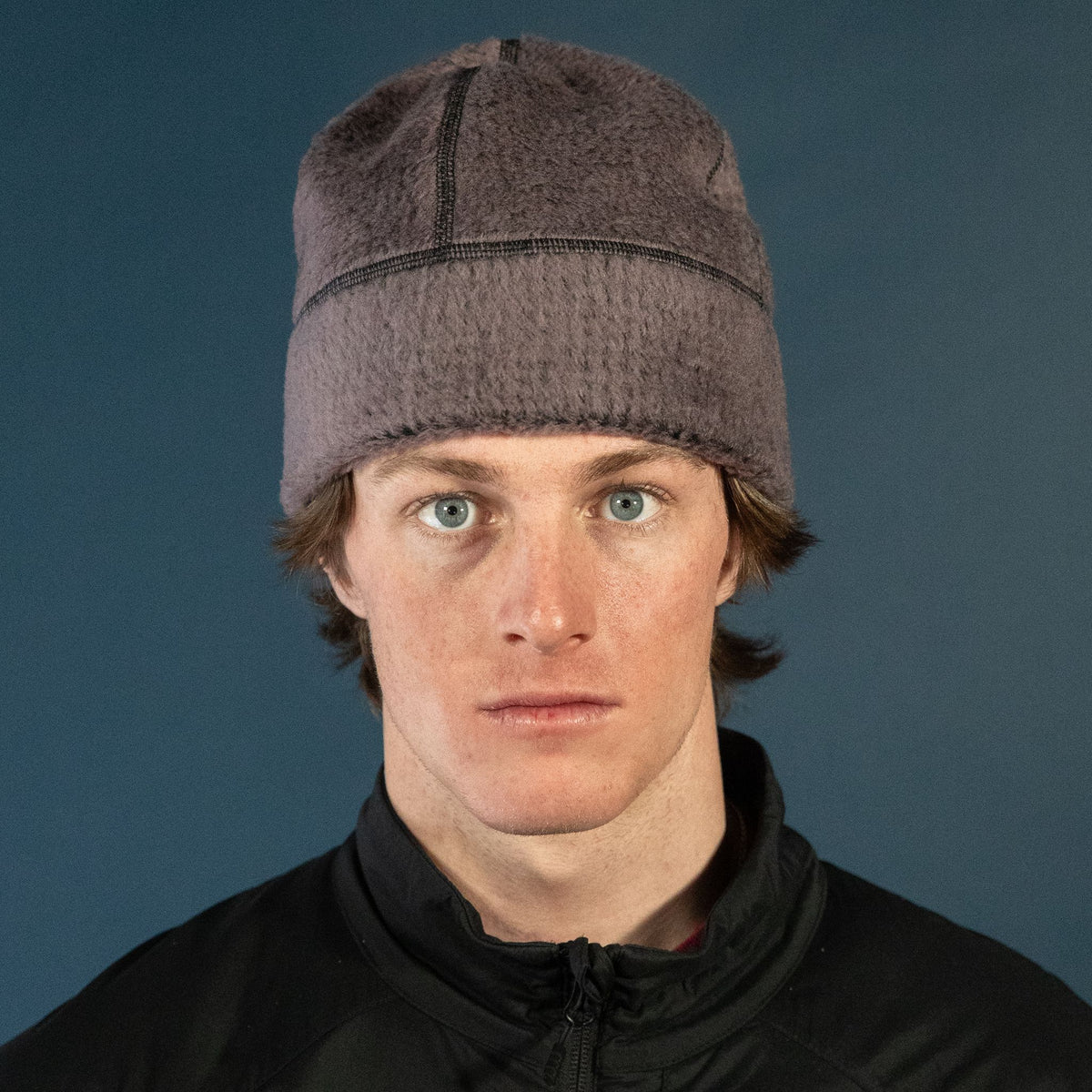 Man wearing the Thurston High Loft™ Wool Beanie in moonscape/black, studio portrait