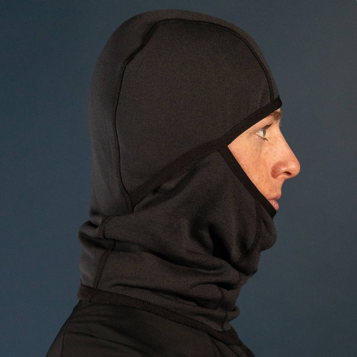 Man wearing the Thurston Power Wool™ Balaclava in black, studio portrait